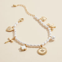 Pearl Charm Bracelet – Cross, Heart, Compass, Clover and Bow Charms With Adjustable Chain