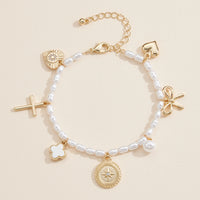 Pearl Charm Bracelet – Cross, Heart, Compass, Clover and Bow Charms With Adjustable Chain