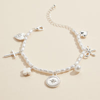 Pearl Charm Bracelet – Cross, Heart, Compass, Clover and Bow Charms With Adjustable Chain