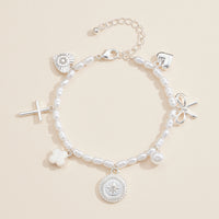 Pearl Charm Bracelet – Cross, Heart, Compass, Clover and Bow Charms With Adjustable Chain