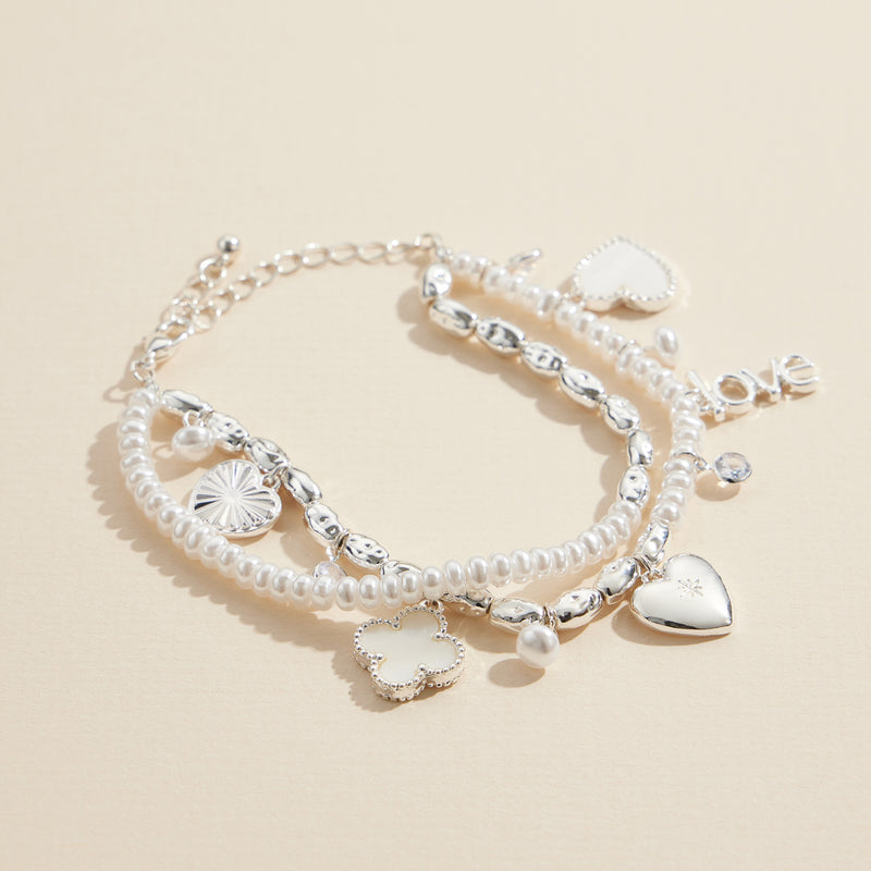 Layered Pearl Charm Bracelet – Love, Heart, and Clover Pendants