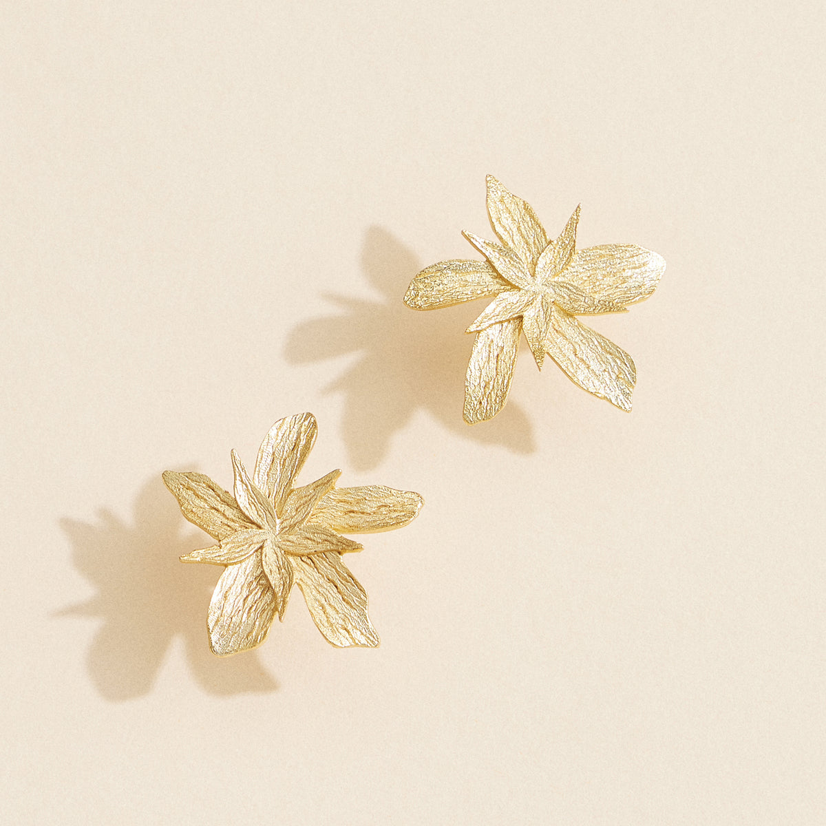 Gold Lily Flower Stud Earrings – Elegant Textured Floral Jewelry