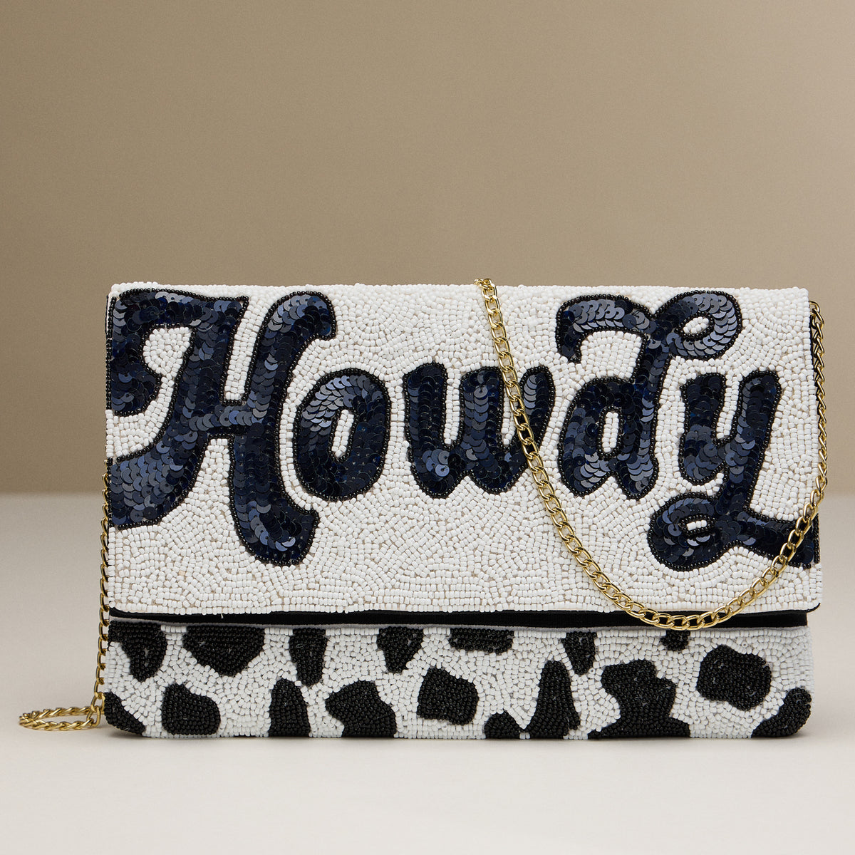 Beaded "Howdy" Western Clutch – Handmade Cow Print Purse with Gold Chain