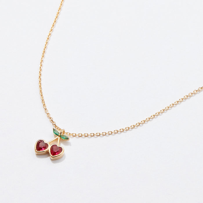 Gold Cherry Necklace with Heart-Shaped Red Stones & Green Leaf Accents – Dainty & Elegant Jewelry